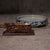 Ceramic Chinese water bowl with blue decorative pattern, Chinese fineline sumi brush resting on a wooden dragon brush rest