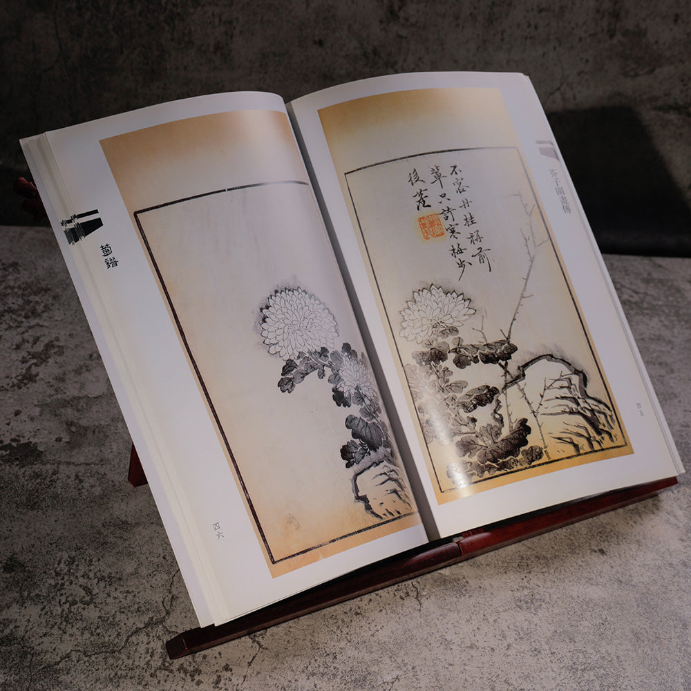 Learning Book for Traditional Chinese Sumi and Ink and Wash Painting opened and standing on a wooden foldable book stand