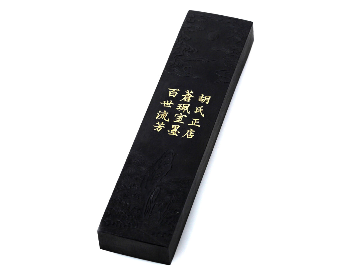 Black ink stick for oriental brush painting, kanji and shodo producing glossy black ink with decorative carvings in its body