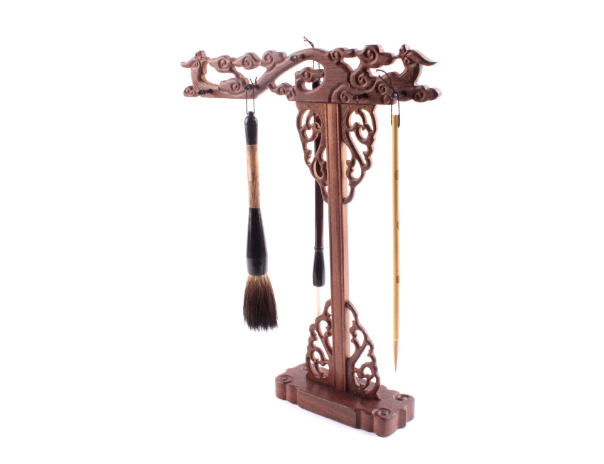 Traditional chinese wooden brush hanger with hand carvings of Chinese phoenixes to store long shodo and ink and wash paint brushes correctly - this image displays how the brushes are hung the correct way.