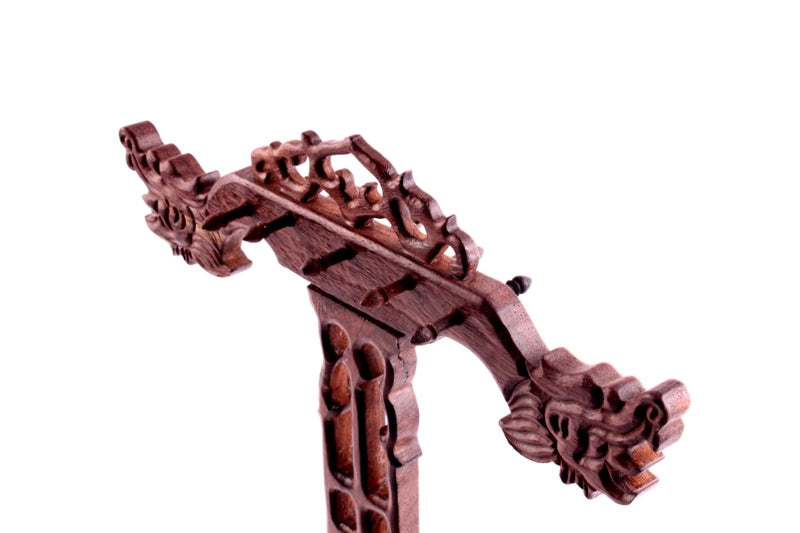 Close-up picture of the hand carved dragons on the upper part of a Chinese brush rack to store shodo calligraphy and sumi brushes