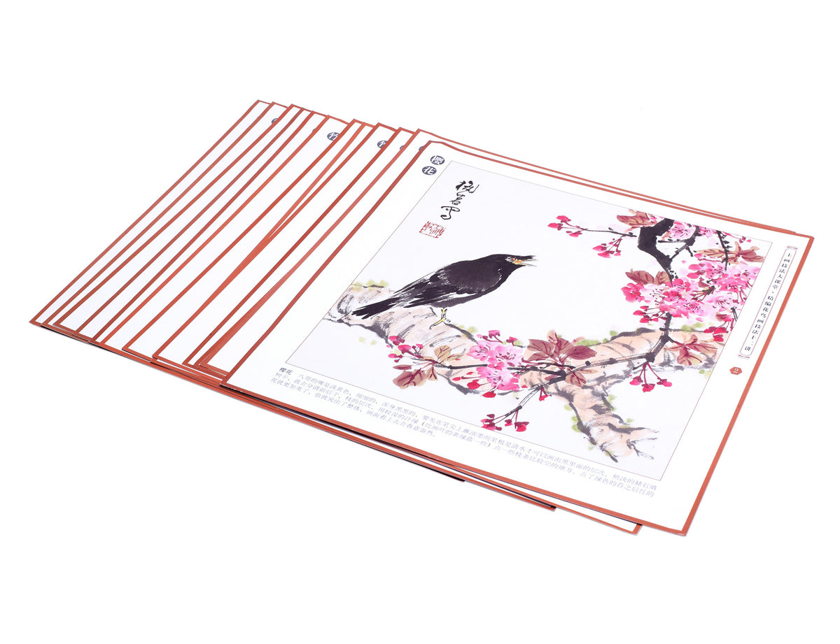 demonstrating part of this book of a nice sumi painting of a bird and beautiful flowers reaching out the branches