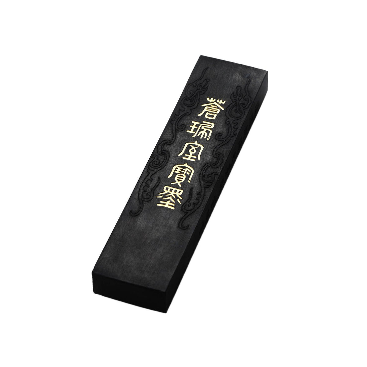 Black ink stick for oriental brush painting, kanji and shodo producing glossy black ink with decorative carvings in its body