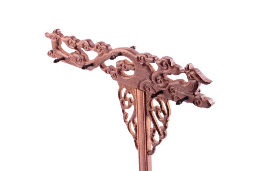 Closeup image of hand carving of phoenixes on a Chinese brush rack used to hang up to ten long calligraphy and sumi brushes