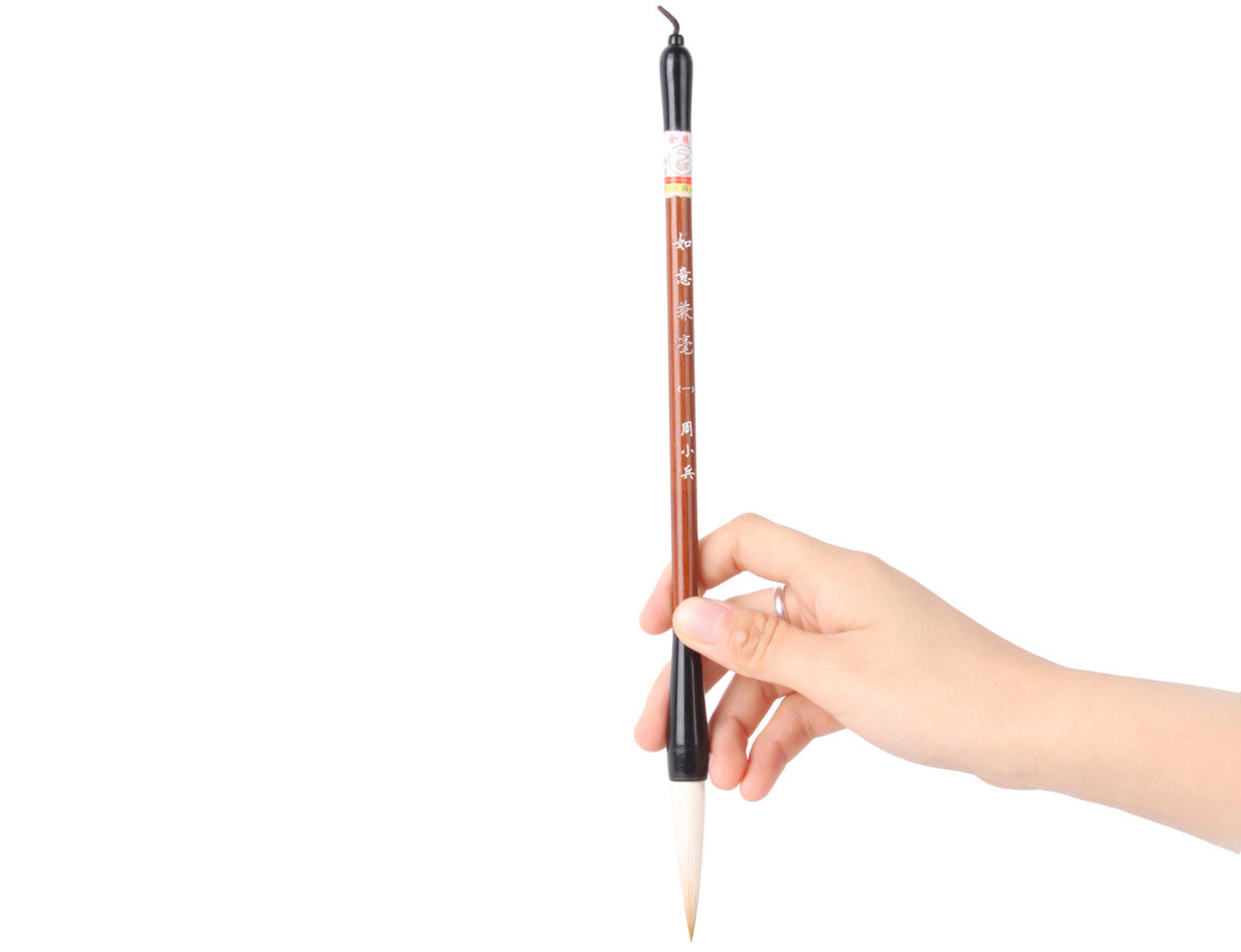 using your hand to gently hold it by about two fifths of its handle, you are ready to start your own personal caligraphy or sumi creation journey