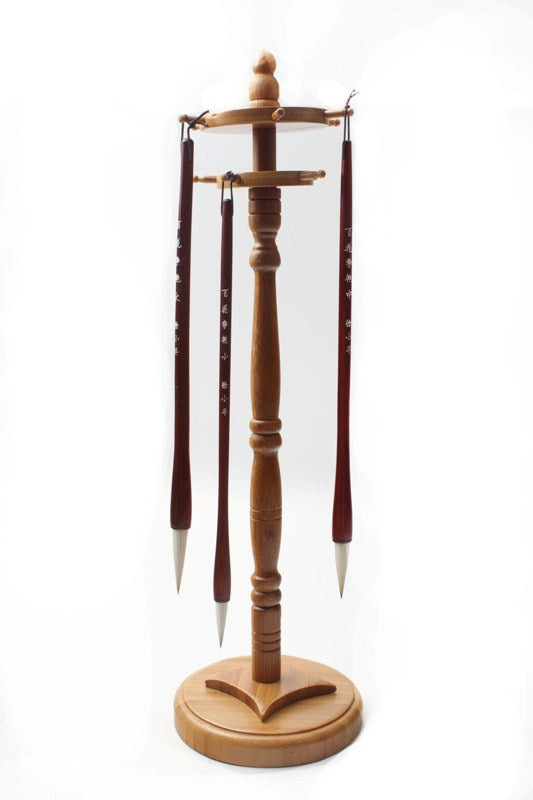 Chinese traditional brush rack with spinning   wheels on top to hang long brushes showing how   they are attached to the hooks