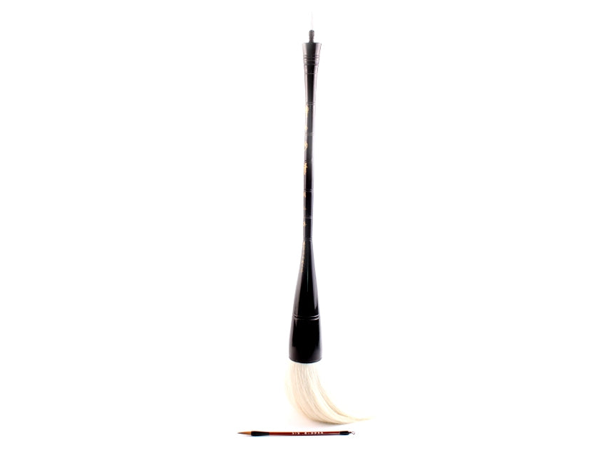 White goat hair bristles of a extra large oriental paint artist brush used to paint on supersized canvas or for two-hand big script calligraphy and shodo