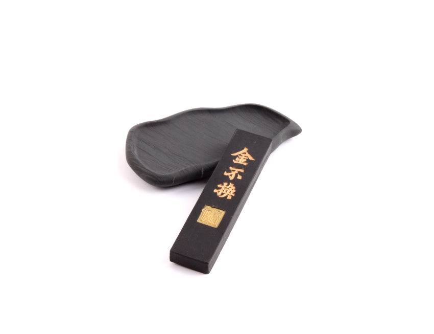 Chinese ink stone slab of dark coarse silent shi yan stone taken togethe with a small Chinese ink stick