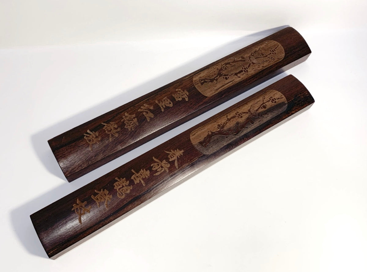 A pair of high quality paper weights to stablish the paper