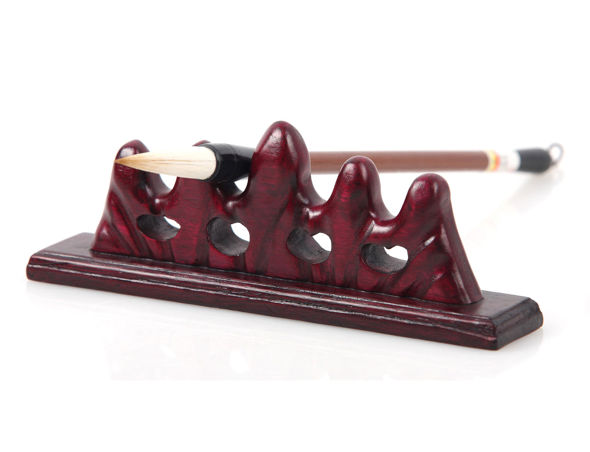 usage view of the moving the mountain brush rest indicating how you can use it to rest your calligraphy and sumi brushes