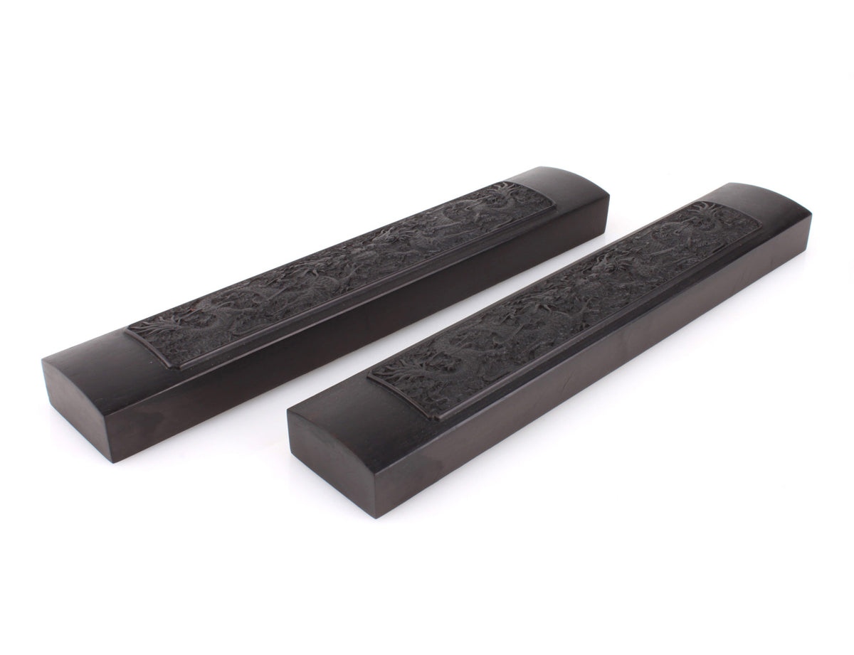 a pair of soaring dragon paper weights which are a great item for you to add in your study room and can be used to press the xuan paper when you are creating a sumi or calligraphy artwork