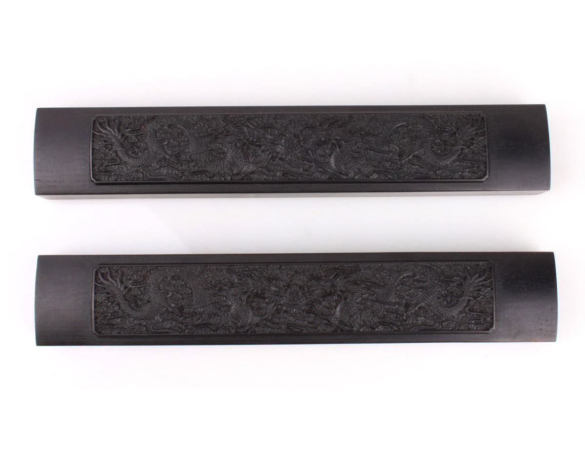 top view of this pair of soaring dragon paper weights for you keep the xuan paper under control when you are creating a sumi / calligraphy artwork