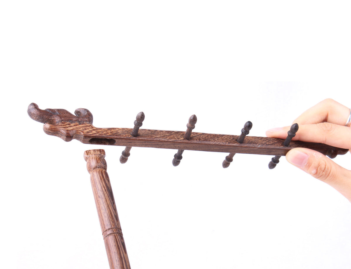 with chinese traditional wood handicraft technology this brush hanger is totally made of wood without any steel or iron component which is a great accessory in your study room for calligraphy and sumi-e creation-head view