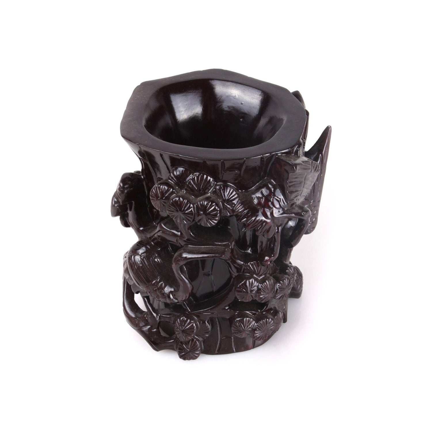black wooden brush holder whose surface is delicately carved into cranes that are dancing on the lotus