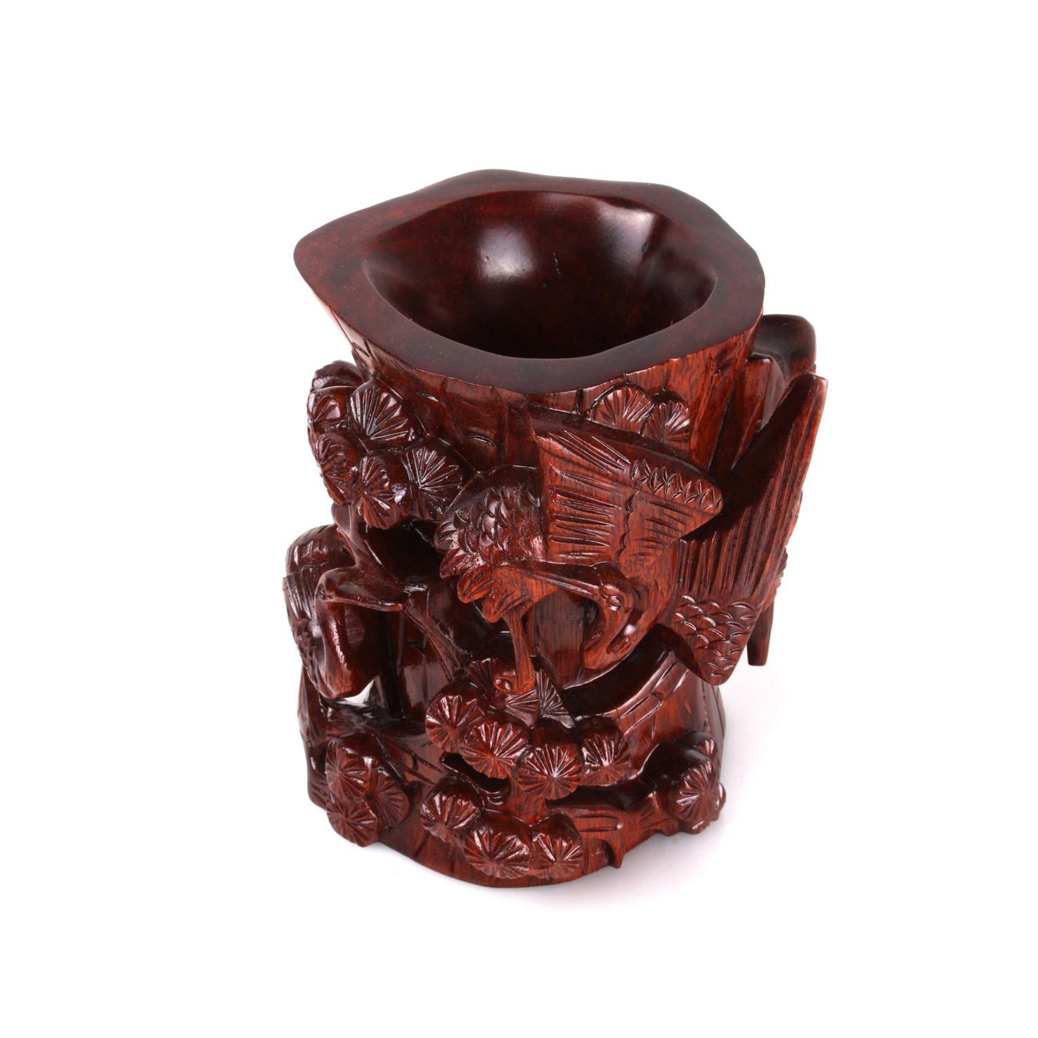 brown wooden brush holder whose surface is delicately carved into cranes that are dancing on the lotus