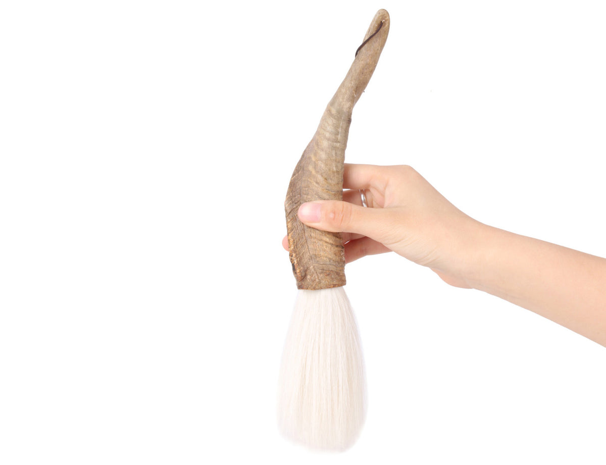 usage view of the shangrila white goat hair calligraphy and sumi brush whose tip is resillient and can carry enough ink for your art creation