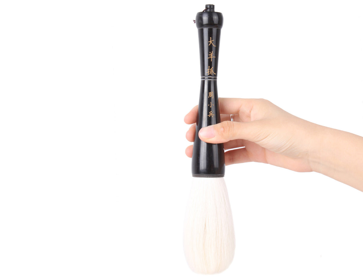 usage view showing how to hold this beauty of silence white goat hair paint brush for your sumi-e and calligraphy art creation