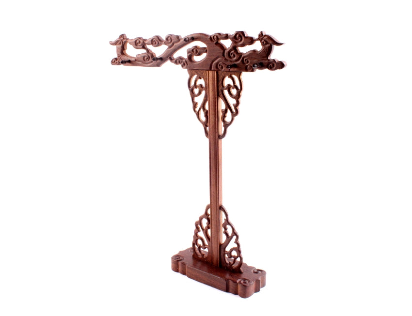 Stand alone image of a wooden Chinese brush hanger for hanging up to ten sumi and shodo calligraphy brushes to store them, the brush rack is decorated with hand carved phoenixes
