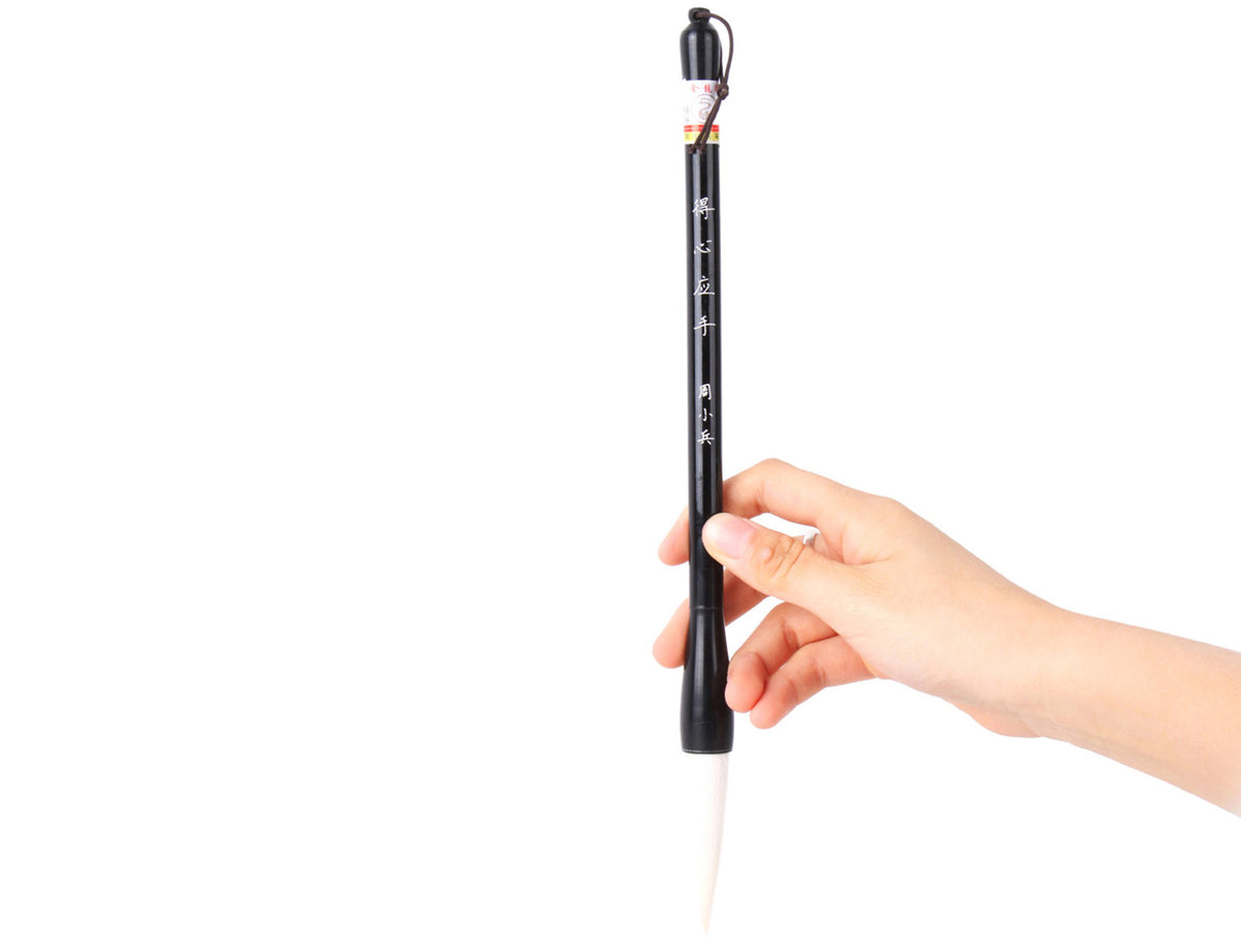 usage view with your hand holding this brush a little bit above the tip of this brush for an easy while firm grasp